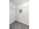 A walk-in closet is equipped with white wire shelving and neutral gray carpeting at 16062 Se 89Th Ter, Summerfield, FL 34491