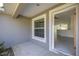 Sunlit entryway showcasing tile flooring and a view into the open-concept living area at 16062 Se 89Th Ter, Summerfield, FL 34491