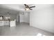 Bright open-concept living area with tile flooring and modern lighting fixtures at 16062 Se 89Th Ter, Summerfield, FL 34491