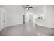 Spacious living area with tile floors, recessed lighting, and an open view to the kitchen at 16062 Se 89Th Ter, Summerfield, FL 34491