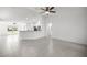 Bright open-concept living area with tile flooring and modern lighting fixtures at 16062 Se 89Th Ter, Summerfield, FL 34491