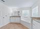 Bright bathroom featuring double vanity, soaking tub, and window with privacy glass blocks at 17233 Se 115Th Terrace Rd, Summerfield, FL 34491
