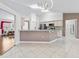 Open-concept kitchen with breakfast bar and views to dining area at 17233 Se 115Th Terrace Rd, Summerfield, FL 34491
