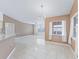 Open living area with tile floors, modern lighting, and neutral paint at 17233 Se 115Th Terrace Rd, Summerfield, FL 34491