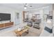 Open-concept living area with seating area and kitchen views at 17233 Se 115Th Terrace Rd, Summerfield, FL 34491