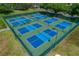 A fenced in tennis court offers multiple well maintained courts for residents to enjoy at 17233 Se 115Th Terrace Rd, Summerfield, FL 34491