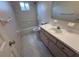 Bright bathroom with tile flooring, bathtub, and a vanity with ample countertop space at 17522 Se 96Th Ct, Summerfield, FL 34491