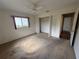Bedroom with carpet, ceiling fan, window, and closet at 17522 Se 96Th Ct, Summerfield, FL 34491