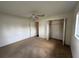 Bedroom with light-colored walls, carpet flooring, and closet space at 17522 Se 96Th Ct, Summerfield, FL 34491