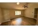 View of an open living room with wood floors and natural light from a window at 17522 Se 96Th Ct, Summerfield, FL 34491