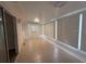 Bright sunroom features tile flooring and sliding glass doors, perfect for indoor-outdoor living at 17522 Se 96Th Ct, Summerfield, FL 34491
