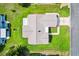 Aerial view showcasing the home's roof, landscaping, and surrounding neighborhood at 17576 Se 96Th Ct, Summerfield, FL 34491