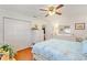 Comfortable bedroom with white furnishings and a spacious closet, perfect for storage at 17576 Se 96Th Ct, Summerfield, FL 34491