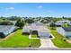 Inviting home with well-kept landscaping and a decorative driveway at 17576 Se 96Th Ct, Summerfield, FL 34491