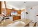 Functional kitchen with wood cabinets, tile flooring, and lots of counter space at 17576 Se 96Th Ct, Summerfield, FL 34491