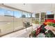 Enclosed patio features tile flooring and an outdoor seating area, perfect for relaxing and enjoying the view at 17576 Se 96Th Ct, Summerfield, FL 34491
