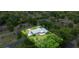 Expansive property featuring mature trees and a long driveway leading up to the residence at 1852 Ne 39Th Ct, Ocala, FL 34470