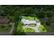 A well-maintained lawn and mature trees surround this charming home, providing privacy at 1852 Ne 39Th Ct, Ocala, FL 34470