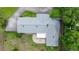 An aerial view of the property showcasing the unique roof design and patio area at 1852 Ne 39Th Ct, Ocala, FL 34470