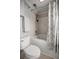 Small bathroom with a shower-tub combo, toilet, and towel rack at 1852 Ne 39Th Ct, Ocala, FL 34470