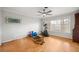 Large bedroom with workout equipment, ceiling fan, and a window at 1852 Ne 39Th Ct, Ocala, FL 34470