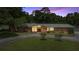Charming single-story brick home featuring a circular driveway and mature landscaping at 1852 Ne 39Th Ct, Ocala, FL 34470