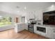 Bright kitchen showing stainless appliances, granite countertops, and brick fireplace view at 1852 Ne 39Th Ct, Ocala, FL 34470