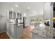 Bright kitchen showcasing granite countertops, stainless appliances, and eat-in bar at 1852 Ne 39Th Ct, Ocala, FL 34470