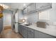 Gray laundry room with washer, dryer, sink, and extra cabinet space at 1852 Ne 39Th Ct, Ocala, FL 34470