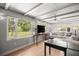 Sunroom with bright windows showing the backyard at 1852 Ne 39Th Ct, Ocala, FL 34470