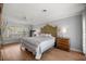 Spacious main bedroom featuring hardwood floors, neutral paint, and a large window at 1852 Ne 39Th Ct, Ocala, FL 34470