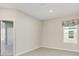 Bedroom with wood flooring and natural light at 1875 Nw 44 Court Rd, Ocala, FL 34482