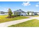 Charming single-Gathering home with beautiful landscaping, a paved driveway and a two-car garage at 1875 Nw 44 Court Rd, Ocala, FL 34482
