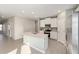 Lovely kitchen featuring a center island, stainless steel appliances, white cabinets, and wood-look tile flooring at 1875 Nw 44 Court Rd, Ocala, FL 34482