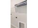 Laundry area featuring connections, shelving, and a neutral color scheme at 1875 Nw 44 Court Rd, Ocala, FL 34482