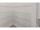 Walk-in pantry with multiple wire shelves, offering ample storage space for food and household items at 1875 Nw 44 Court Rd, Ocala, FL 34482