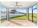 Screened-in porch featuring brick pavers, a ceiling fan, and views of the backyard and neighboring houses at 1875 Nw 44 Court Rd, Ocala, FL 34482