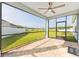 Enjoy the view from this screened porch with brick pavers and a ceiling fan at 1875 Nw 44 Court Rd, Ocala, FL 34482