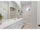 Bright bathroom with a double sink vanity and an arched mirror at 2010 Se 25Th St, Ocala, FL 34471