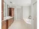 Spacious bathroom features dual vanities, a soaking tub, and tile flooring at 2010 Se 25Th St, Ocala, FL 34471