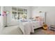 Cozy bedroom with a plush bed and a large window overlooking the yard at 2010 Se 25Th St, Ocala, FL 34471