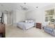 Cozy bedroom features soft carpet, a comfortable bed, and a stylish ceiling fan at 2010 Se 25Th St, Ocala, FL 34471
