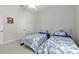 Shared bedroom features twin beds and white doors, ceiling fan, and Bucs decor at 2010 Se 25Th St, Ocala, FL 34471