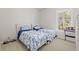 Bright bedroom features two twin beds, large window bringing natural light, and neutral paint at 2010 Se 25Th St, Ocala, FL 34471