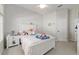 Well-lit bedroom with plush bed, side table, and large window at 2010 Se 25Th St, Ocala, FL 34471