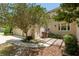 Exterior view highlighting the home's side entrance, landscaping, and a two-car garage at 2010 Se 25Th St, Ocala, FL 34471