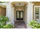 Elegant double front doors framed by grand white columns and decorative stone at 2010 Se 25Th St, Ocala, FL 34471