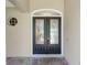 Close up of elegant double front doors with decorative glass inlays and modern hardware at 2010 Se 25Th St, Ocala, FL 34471