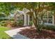Charming home entrance featuring a stone facade and manicured landscaping at 2010 Se 25Th St, Ocala, FL 34471