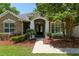 Inviting front entrance with stone accents and decorative landscaping at 2010 Se 25Th St, Ocala, FL 34471